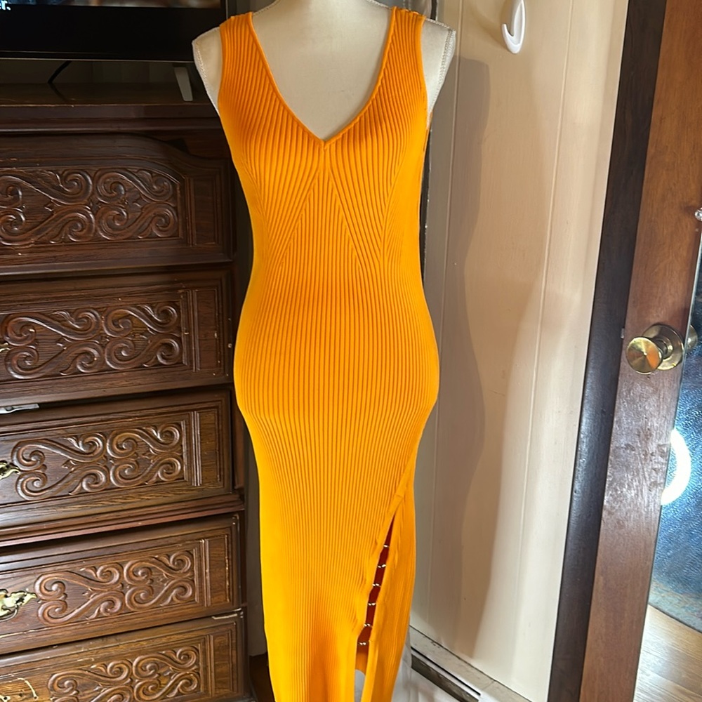 NWT House of Harlow 1960, orange dress, with silver ring accents. Size medium.